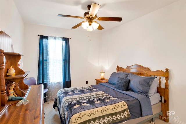 bedroom with light carpet and ceiling fan