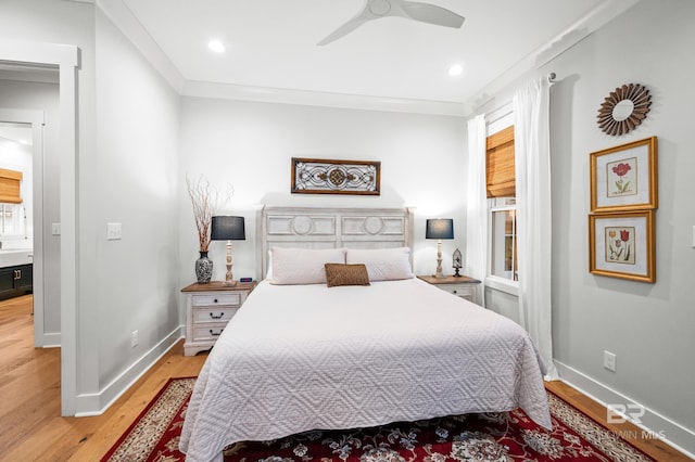 bedroom with ceiling fan, ornamental molding, and light hardwood / wood-style flooring