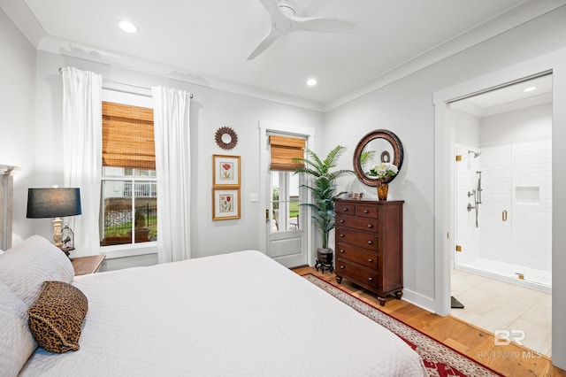 bedroom featuring ensuite bath, ceiling fan, ornamental molding, and hardwood / wood-style flooring