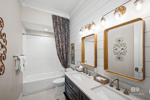 full bathroom with tile patterned floors, vanity, wooden walls, shower / bath combo with shower curtain, and toilet