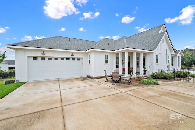 back of property featuring a patio and a garage