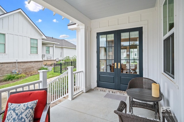 entrance to property featuring french doors and a porch