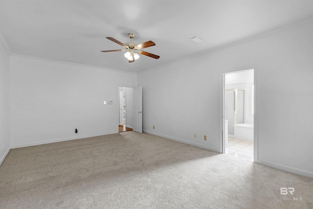 carpeted empty room featuring ornamental molding and ceiling fan