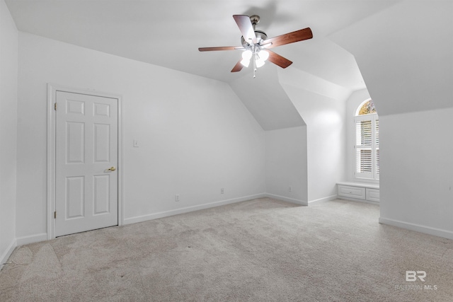 bonus room with lofted ceiling, light colored carpet, and ceiling fan