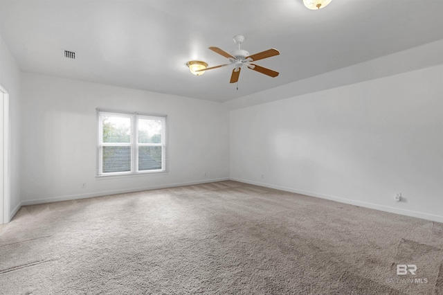 carpeted empty room featuring ceiling fan