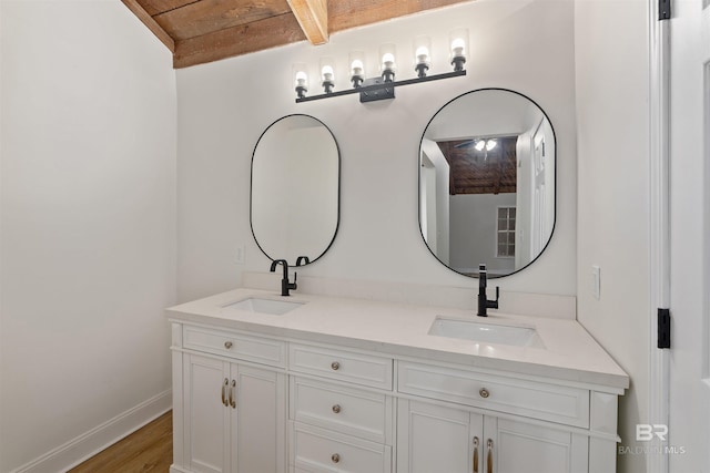 bathroom featuring vanity, wooden ceiling, and hardwood / wood-style flooring