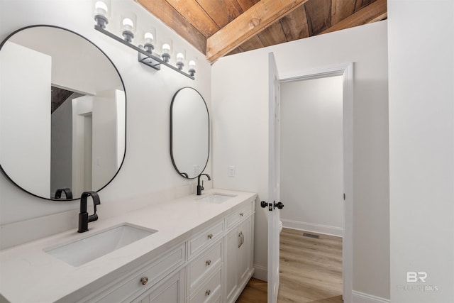 bathroom featuring lofted ceiling with beams, vanity, wooden ceiling, and hardwood / wood-style flooring