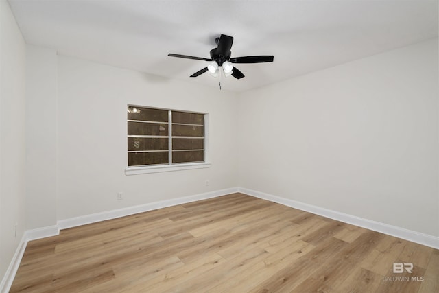 empty room with light hardwood / wood-style flooring and ceiling fan