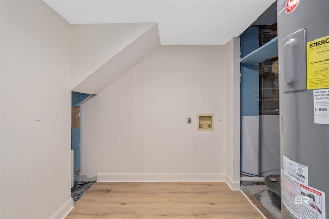 laundry area with washer hookup, wood-type flooring, and electric water heater