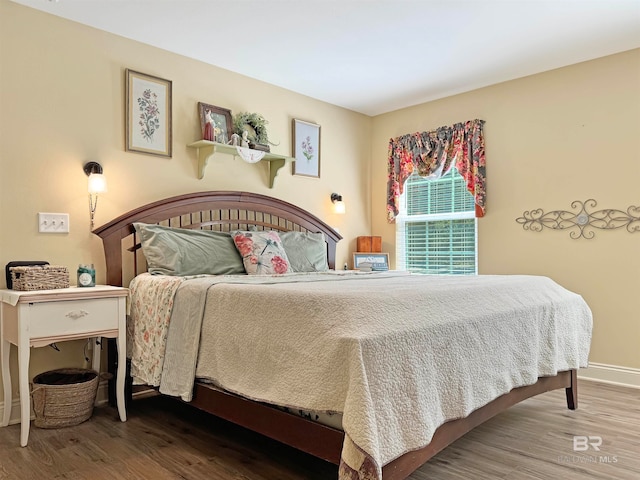 bedroom featuring wood-type flooring