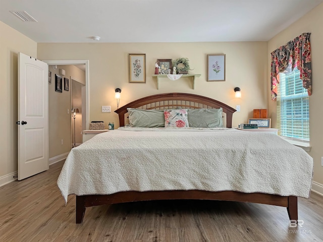 bedroom featuring hardwood / wood-style flooring