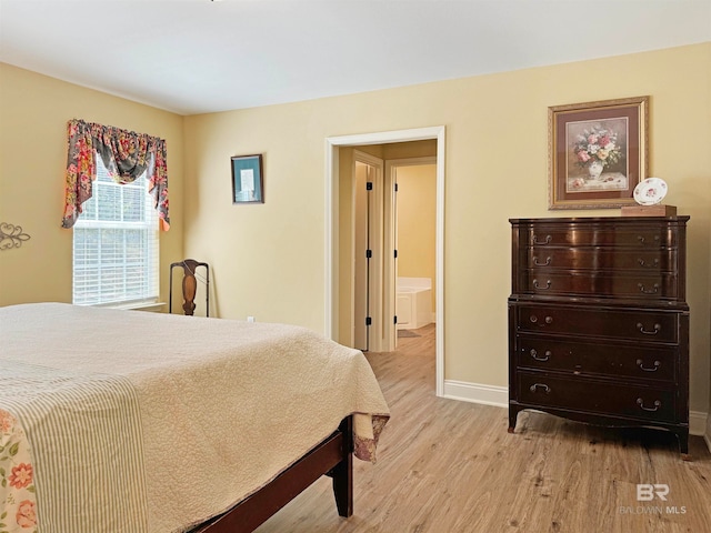 bedroom with light hardwood / wood-style floors