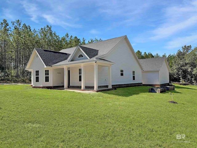 back of house featuring a yard