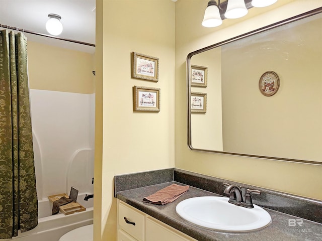 full bathroom featuring vanity, shower / tub combo with curtain, and toilet