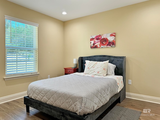 bedroom featuring dark hardwood / wood-style floors