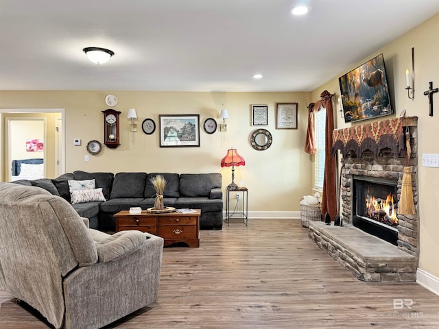 living room featuring a fireplace and light hardwood / wood-style floors