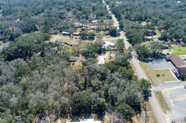 drone / aerial view featuring a view of trees