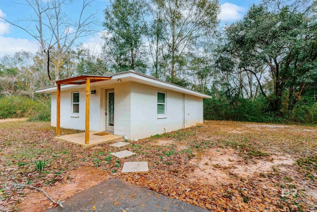 exterior space with concrete block siding