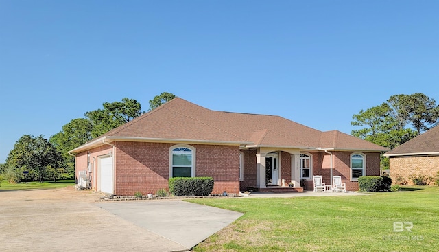 22355 County Road 12, Foley, AL 36535 - view of front facade featuring a front yard, an attached garage, and brick siding