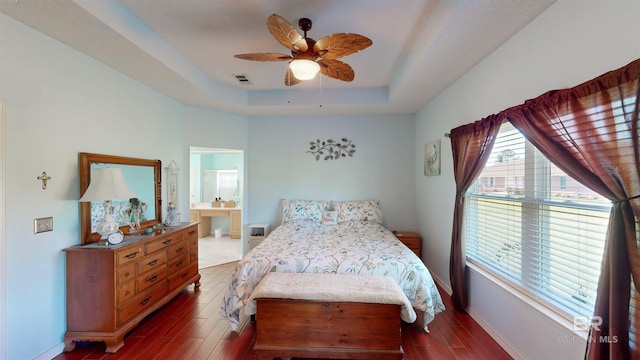22355 County Road 12, Foley, AL 36535 - bedroom with a raised ceiling, wood finished floors, baseboards, a ceiling fan, and ensuite bathroom