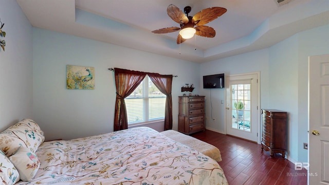 22355 County Road 12, Foley, AL 36535 - bedroom featuring a tray ceiling, dark wood-style flooring, baseboards, and ceiling fan