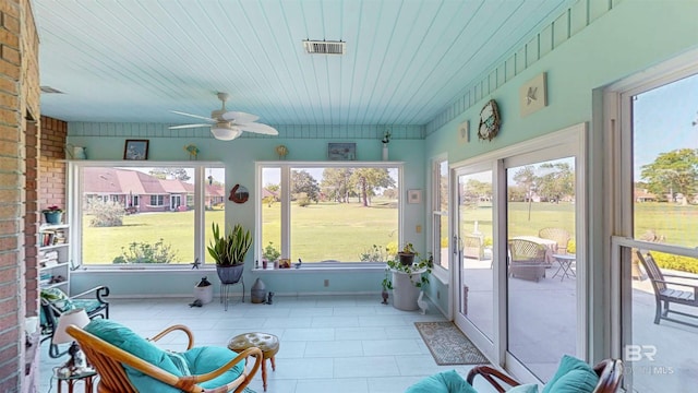 22355 County Road 12, Foley, AL 36535 - sunroom featuring a ceiling fan, tile patterned flooring, and brick wall
