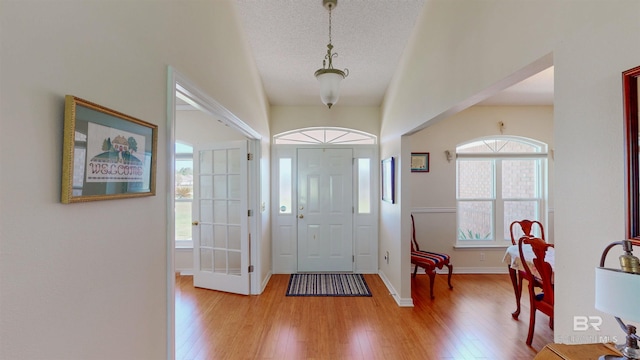 22355 County Road 12, Foley, AL 36535 - foyer entrance with light wood finished floors, a textured ceiling, and baseboards