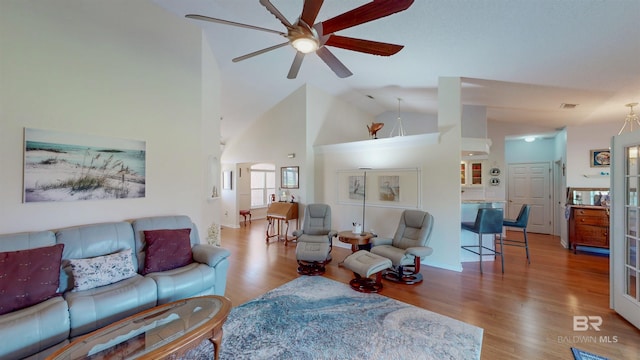 22355 County Road 12, Foley, AL 36535 - living area with a ceiling fan, wood finished floors, high vaulted ceiling, and baseboards