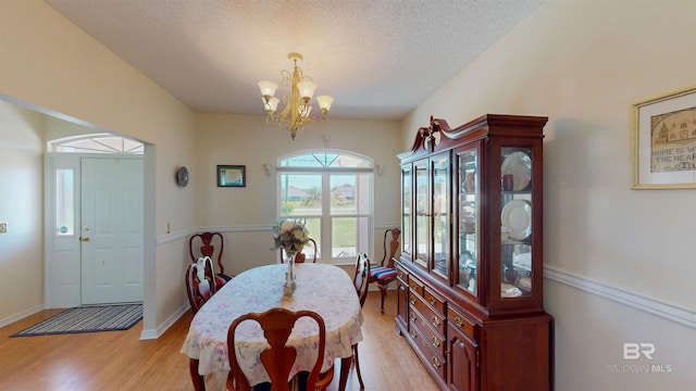 22355 County Road 12, Foley, AL 36535 - dining room with a chandelier, light wood-style floors, a textured ceiling, and baseboards