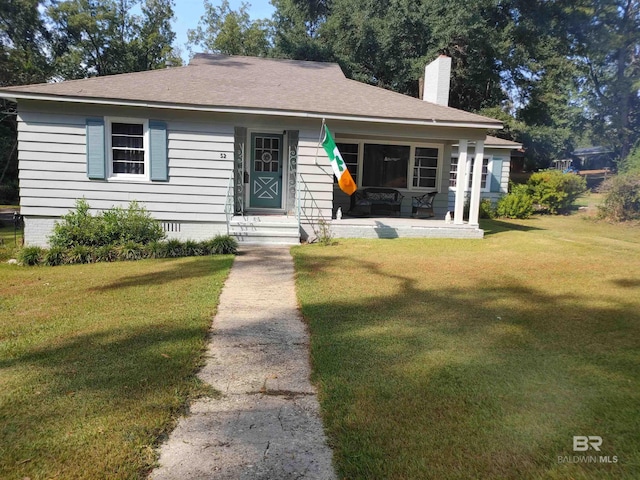 bungalow-style home featuring a front yard