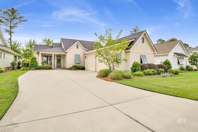 modern farmhouse with a shingled roof, concrete driveway, board and batten siding, a front yard, and a garage