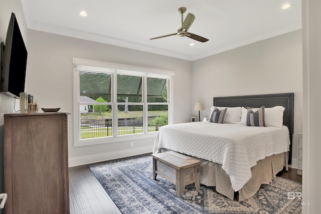 bedroom with dark wood-style flooring, crown molding, recessed lighting, a ceiling fan, and baseboards