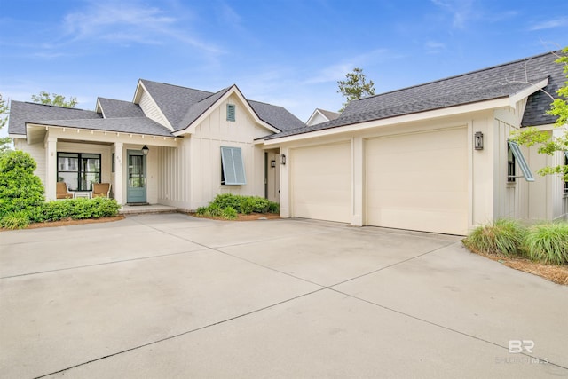 view of front of property featuring a porch and a garage