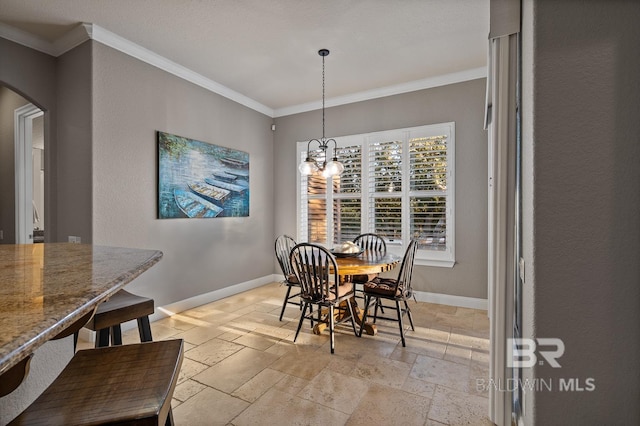 dining space featuring an inviting chandelier and ornamental molding