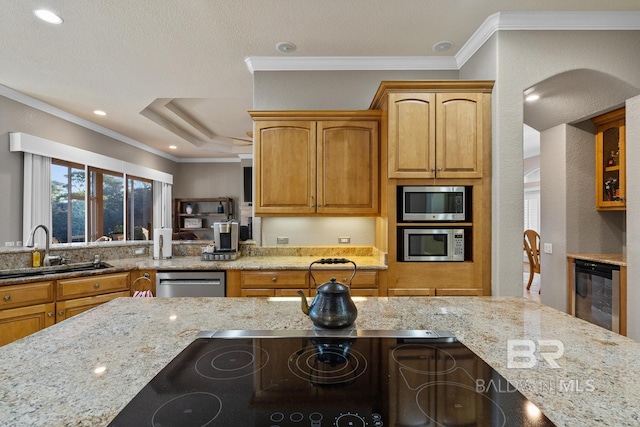 kitchen featuring sink, wine cooler, ornamental molding, light stone counters, and stainless steel appliances