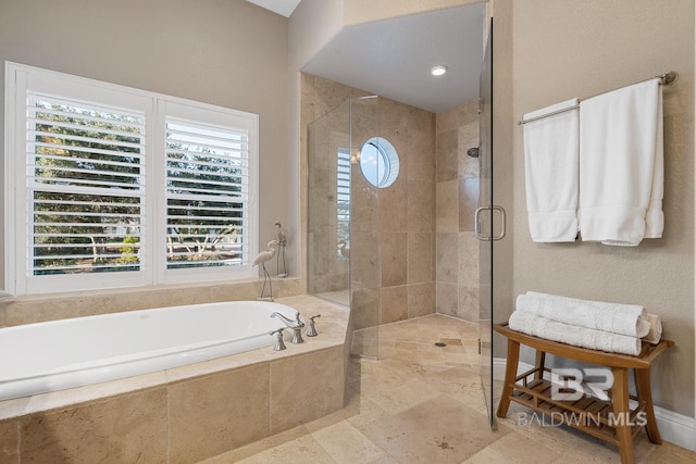 bathroom featuring plus walk in shower