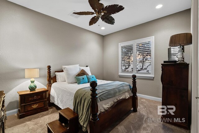 carpeted bedroom featuring ceiling fan