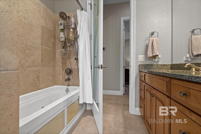 bathroom featuring shower / bath combo with shower curtain and vanity