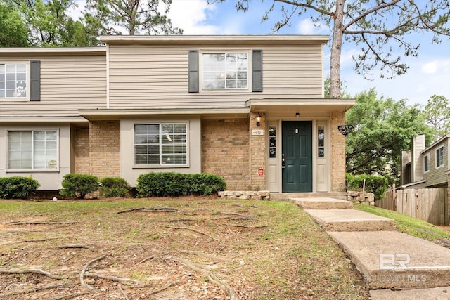 6701 Dickens Ferry Rd Unit 40, Mobile, AL 36608 - view of front of house with brick siding and fence