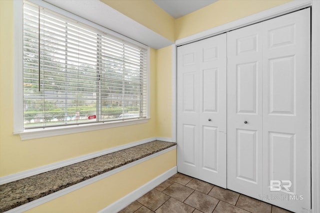 6701 Dickens Ferry Rd Unit 40, Mobile, AL 36608 - mudroom with healthy amount of natural light, tile patterned flooring, and baseboards