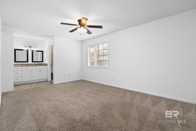 6701 Dickens Ferry Rd Unit 40, Mobile, AL 36608 - unfurnished bedroom with light colored carpet, baseboards, ensuite bath, and ceiling fan