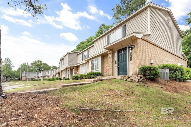6701 Dickens Ferry Rd Unit 40, Mobile, AL 36608 - view of front of house featuring brick siding, cooling unit, and a residential view