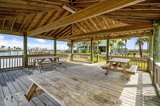 wooden terrace with a water view