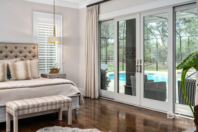 bedroom featuring ornamental molding, french doors, dark wood-style flooring, and access to exterior