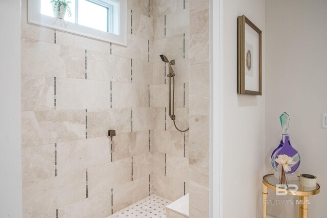 full bath with a tile shower