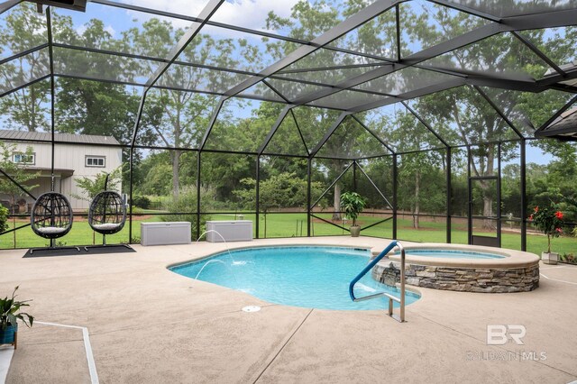 view of swimming pool featuring a yard, a patio, a pool with connected hot tub, and glass enclosure