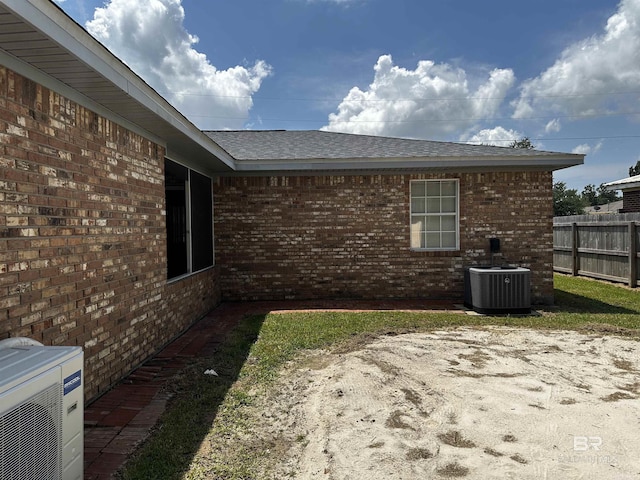 view of home's exterior featuring a patio, ac unit, and central air condition unit