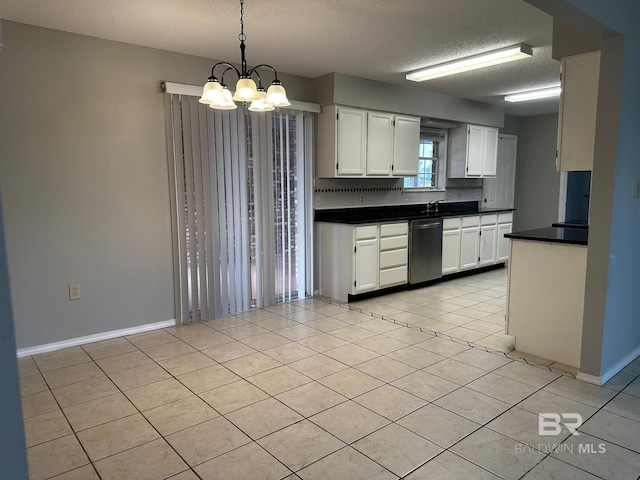 kitchen with light tile patterned flooring, a textured ceiling, hanging light fixtures, dishwasher, and white cabinets