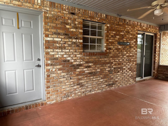 entrance to property featuring ceiling fan