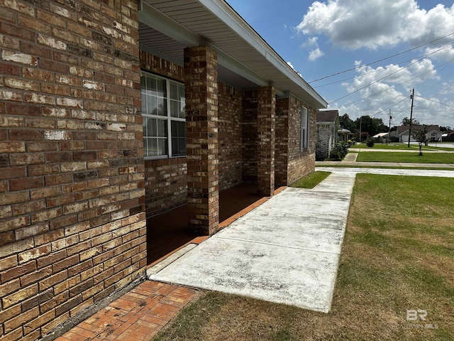 view of home's exterior featuring a lawn